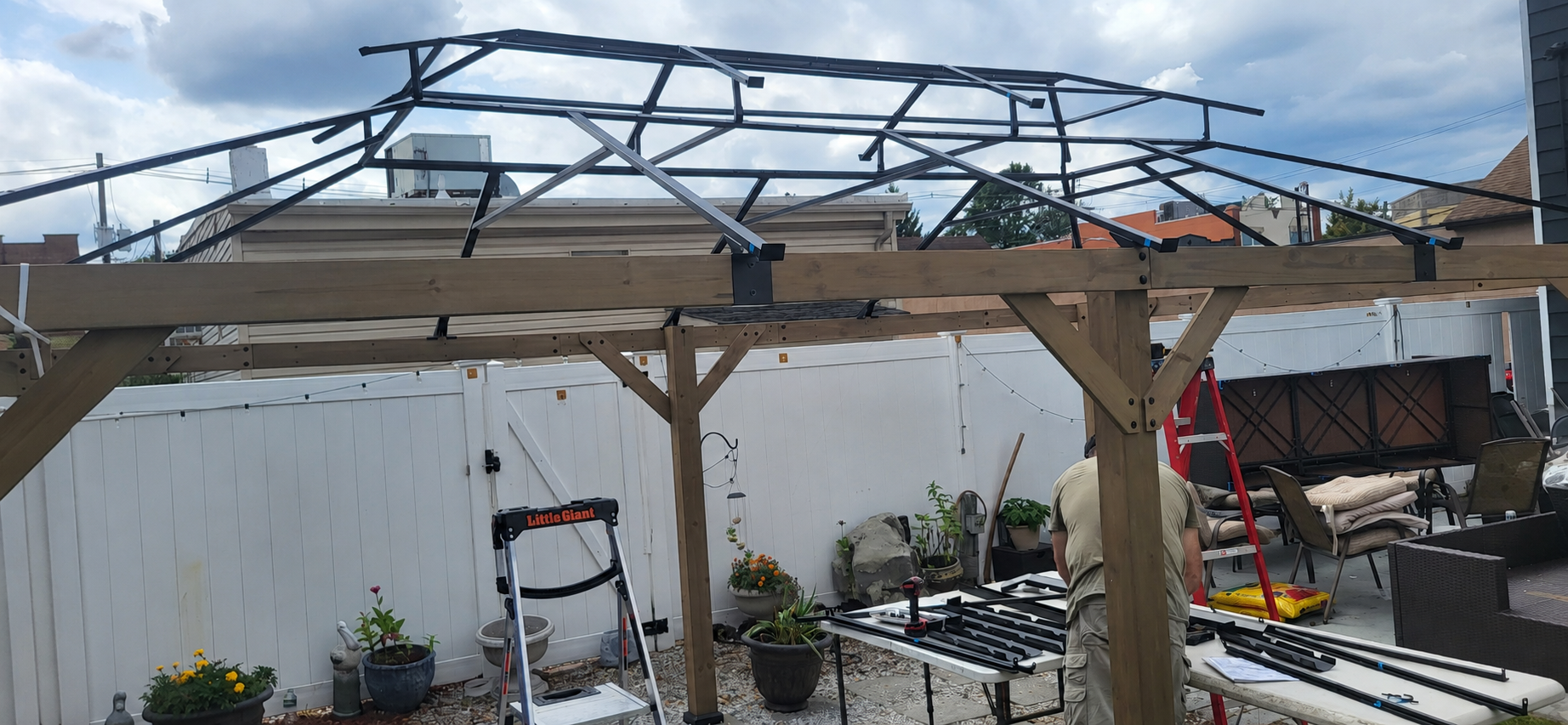Metal gazebo roof framework installed before the roof panels