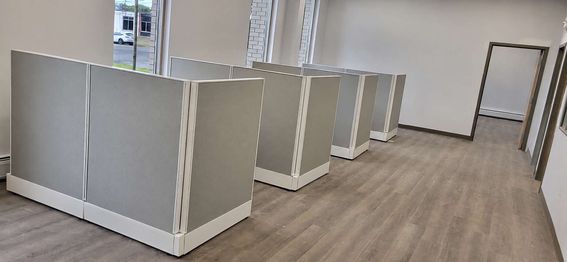 Cubicle panel layout aligned during an in-progress systems furniture installation