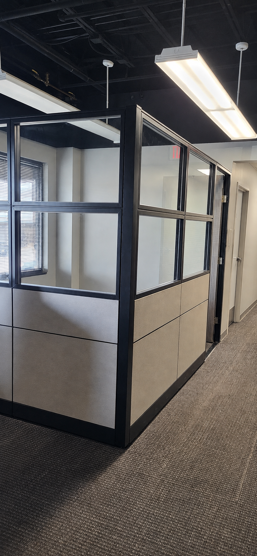 Angled view showing the depth and aligned corners of the modular private office system