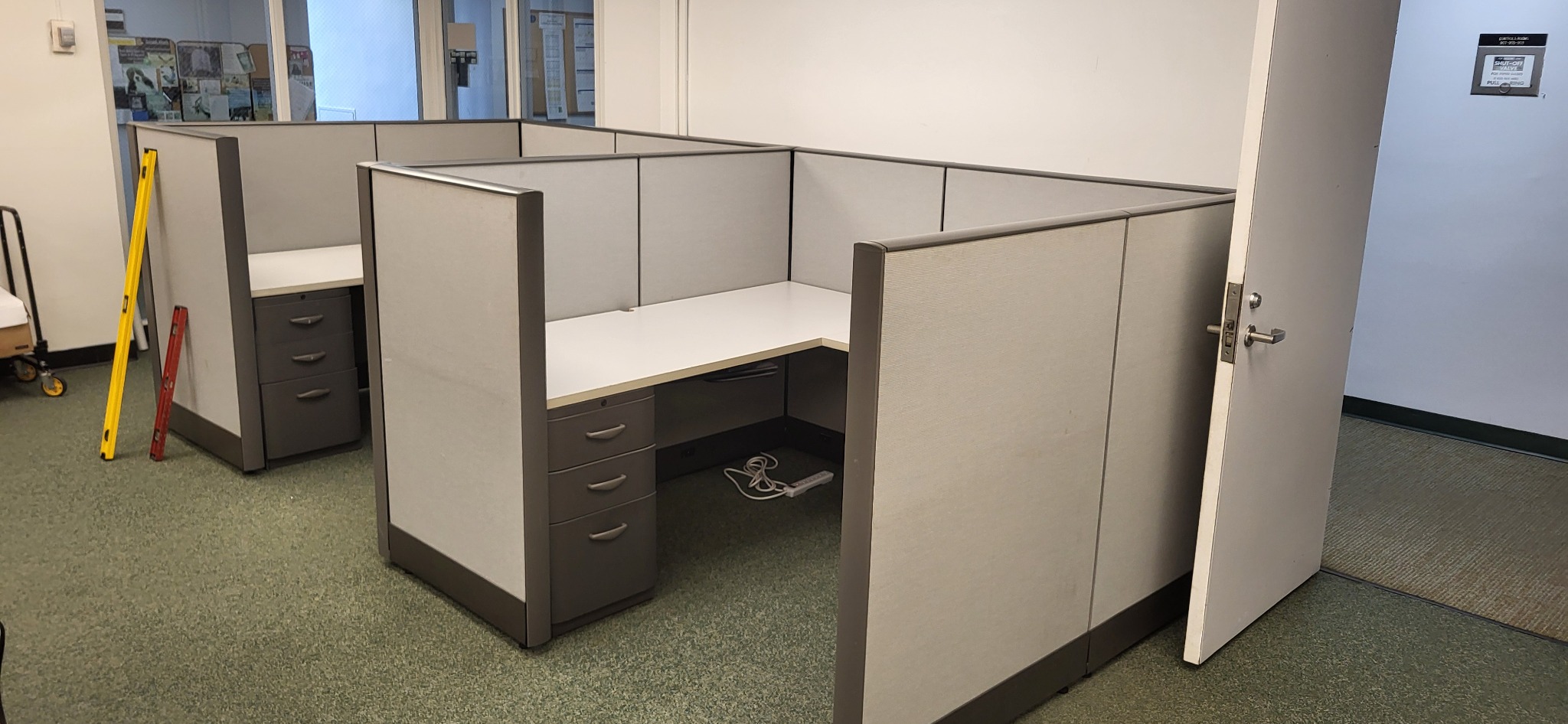 Additional view of the gray cubicle system before disassembly