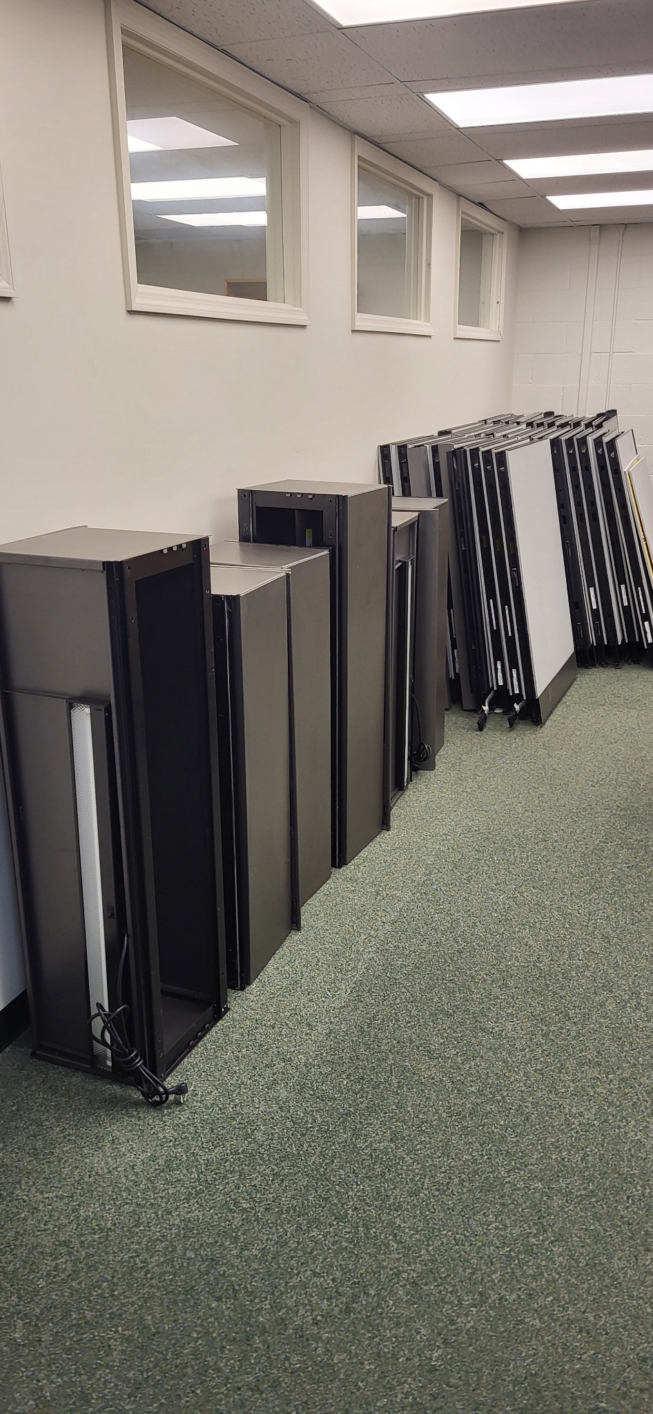Organized cubicle panels and components ready for removal